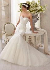 Dress with a train decorated with rhinestones