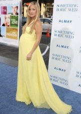 Festive long yellow dress with a train for pregnant women