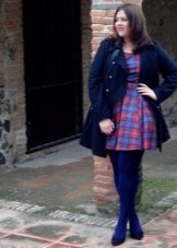 Dress in a blue-red cage for obese women in combination with blue tights and a blue coat