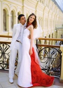 Red item on the back of the wedding dress