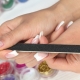 Can I grow my nails during pregnancy and what are the limitations?