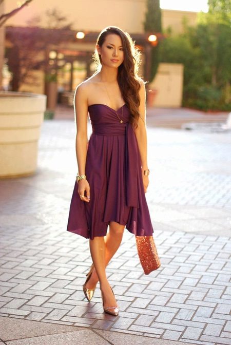 Orange bag to the purple dress
