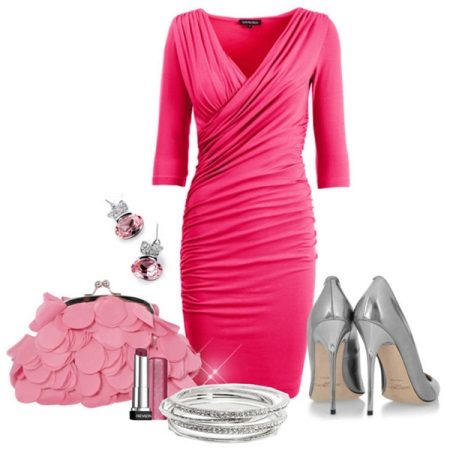 Silver shoes under a pink dress